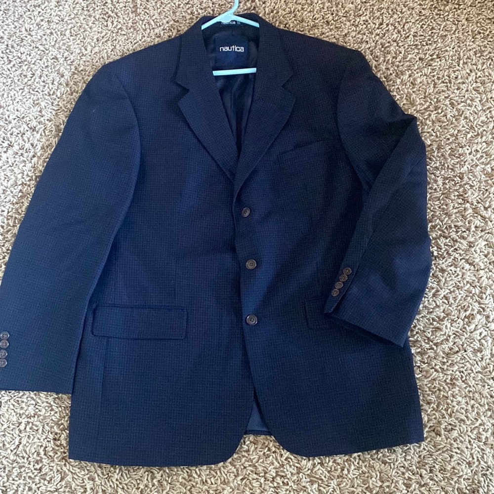 Nautica blue checked sport coat.Gently worn. Pockets still sewed shut.Like new